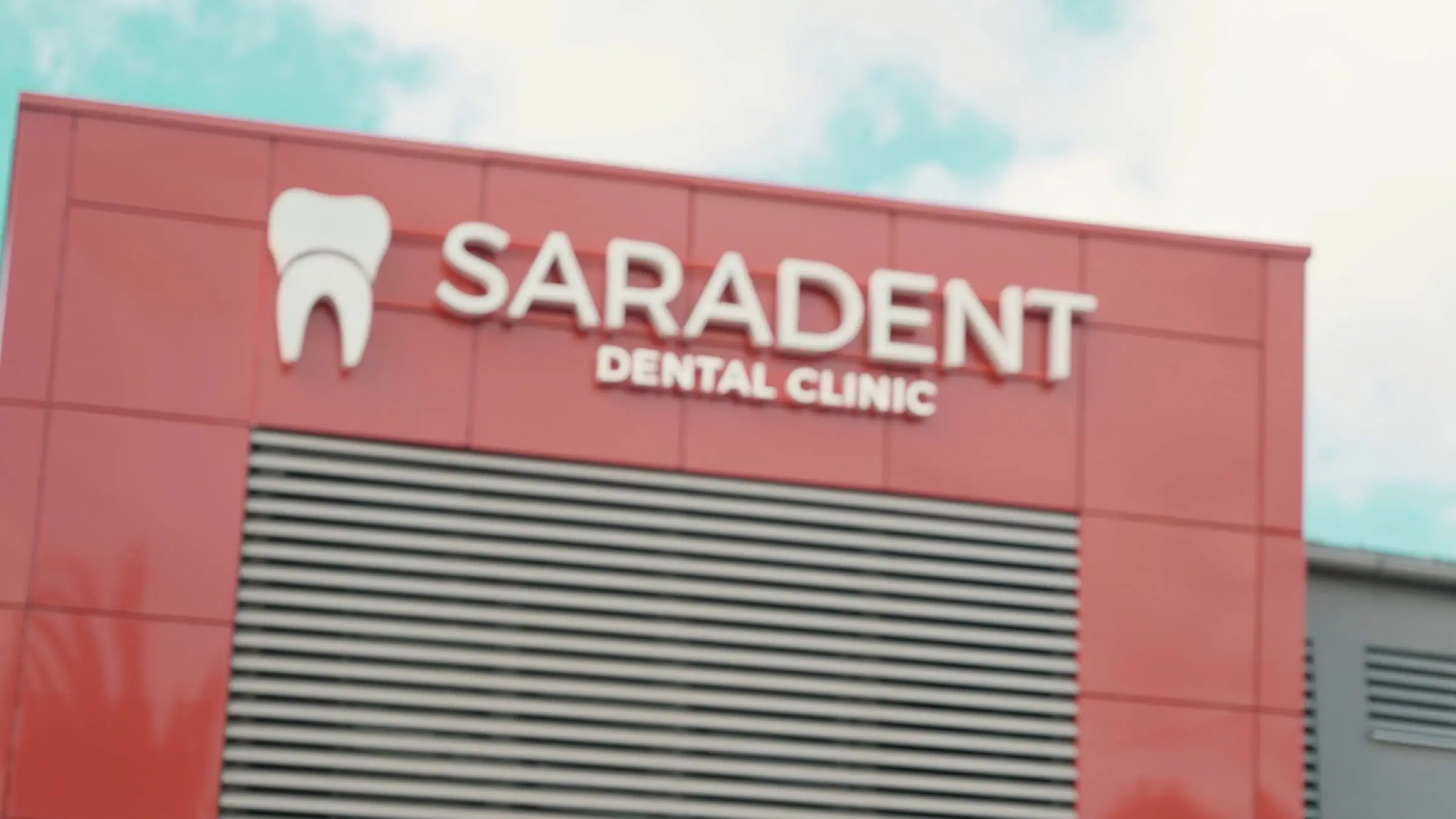 Saradent Dental Clinic sign on the building façade