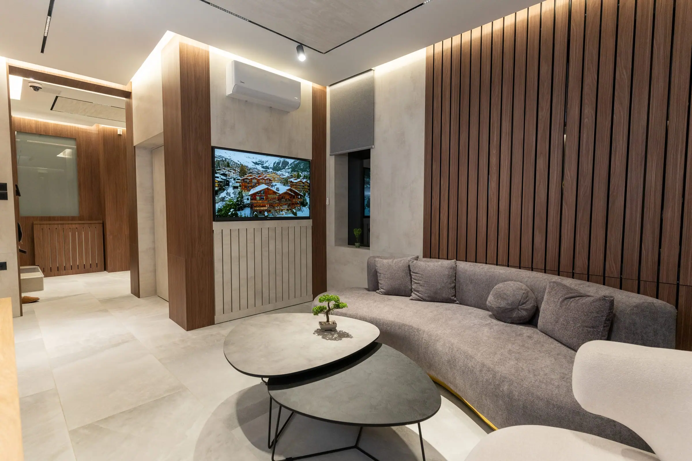 Waiting area with a comfortable sofa and a TV
